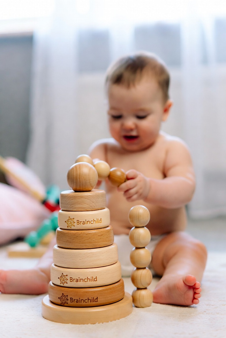 Baby playing with Brainchild toy